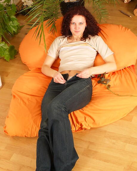 Slim youthful Andrea baring small tits and masturbating 