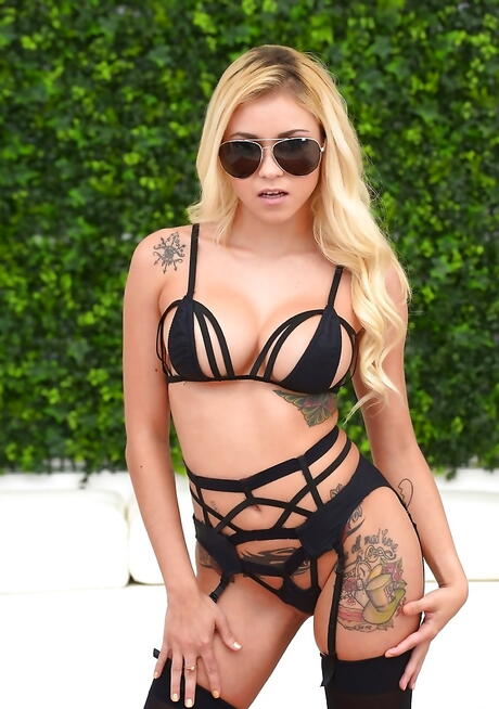 Tempting american blonde Marsha May in hot underwear reveals big titties and shaved pussy outdoor